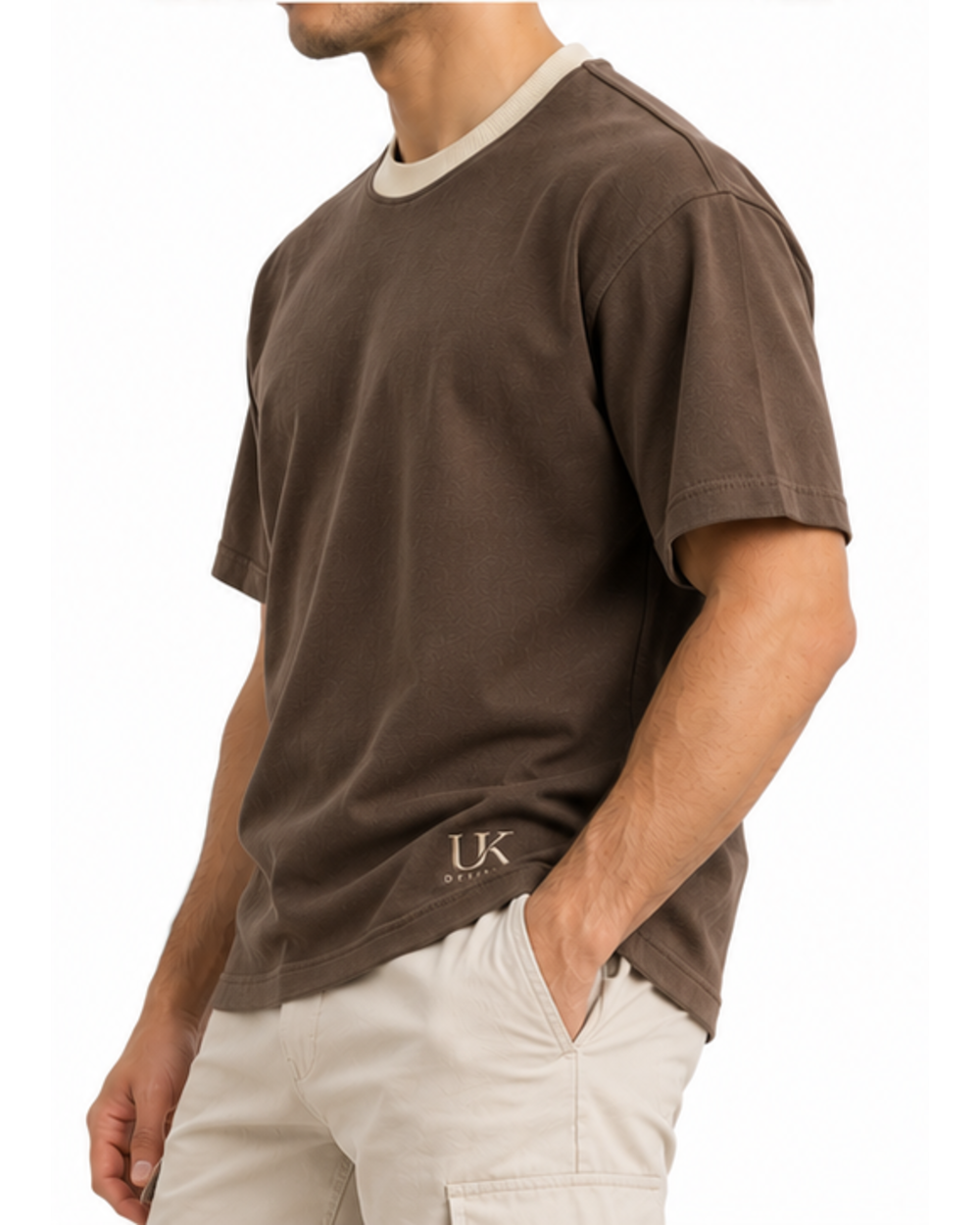 Side view of the boxy T-shirt on a model with sand trousers