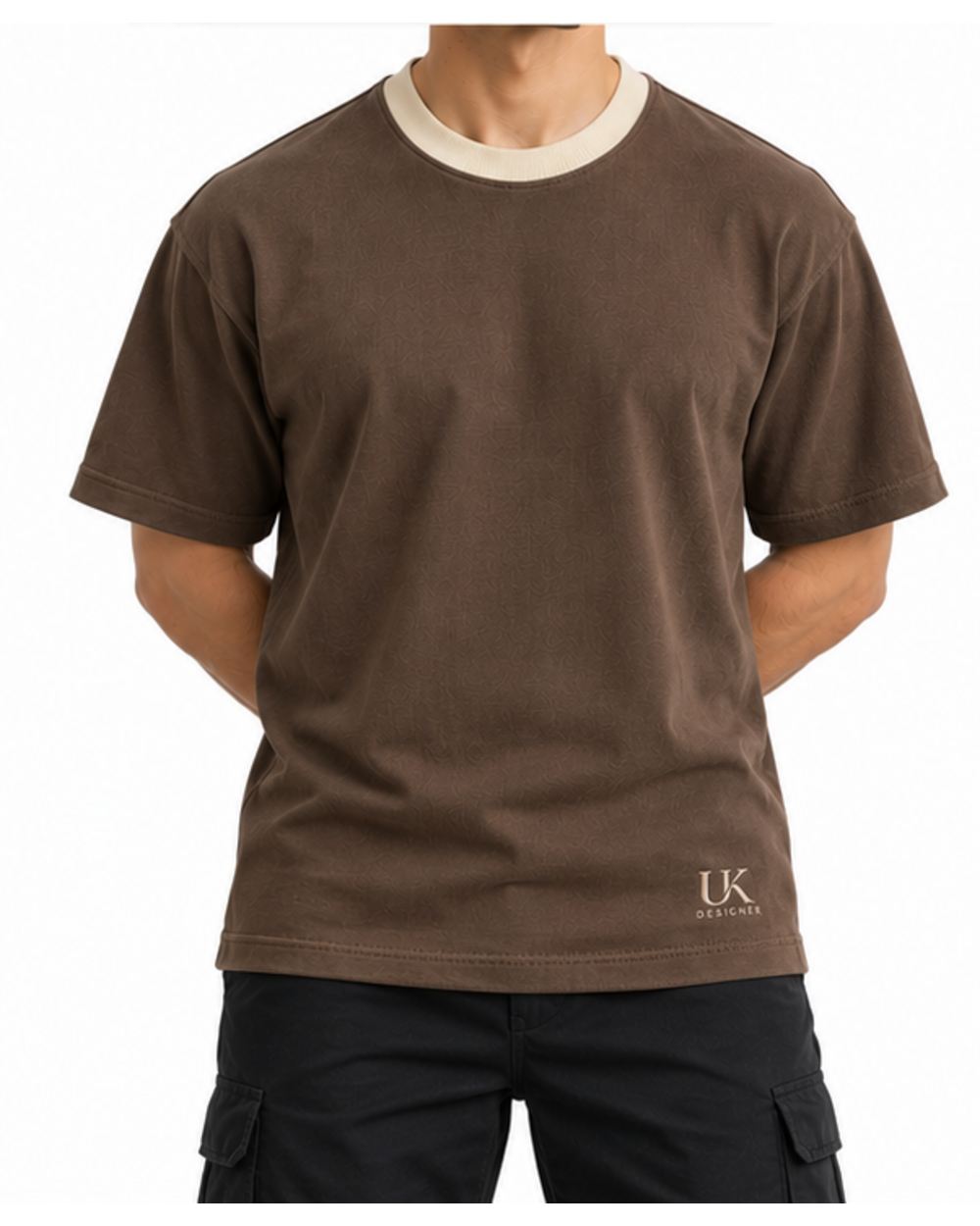 Model in the clay brown boxy T-shirt with black cargo trousers