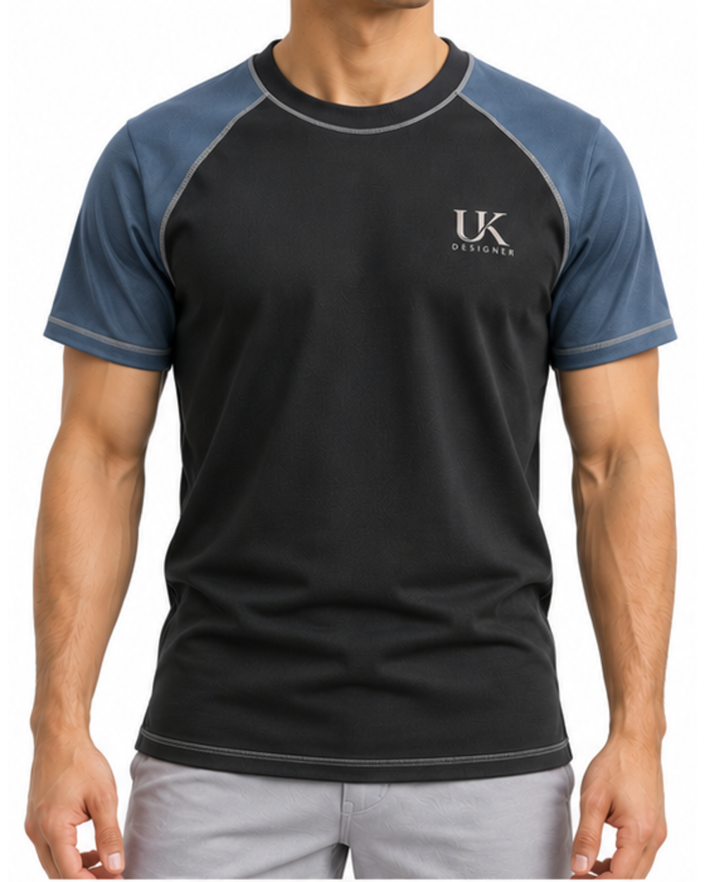 Model wearing the black raglan T-shirt with grey trousers, front