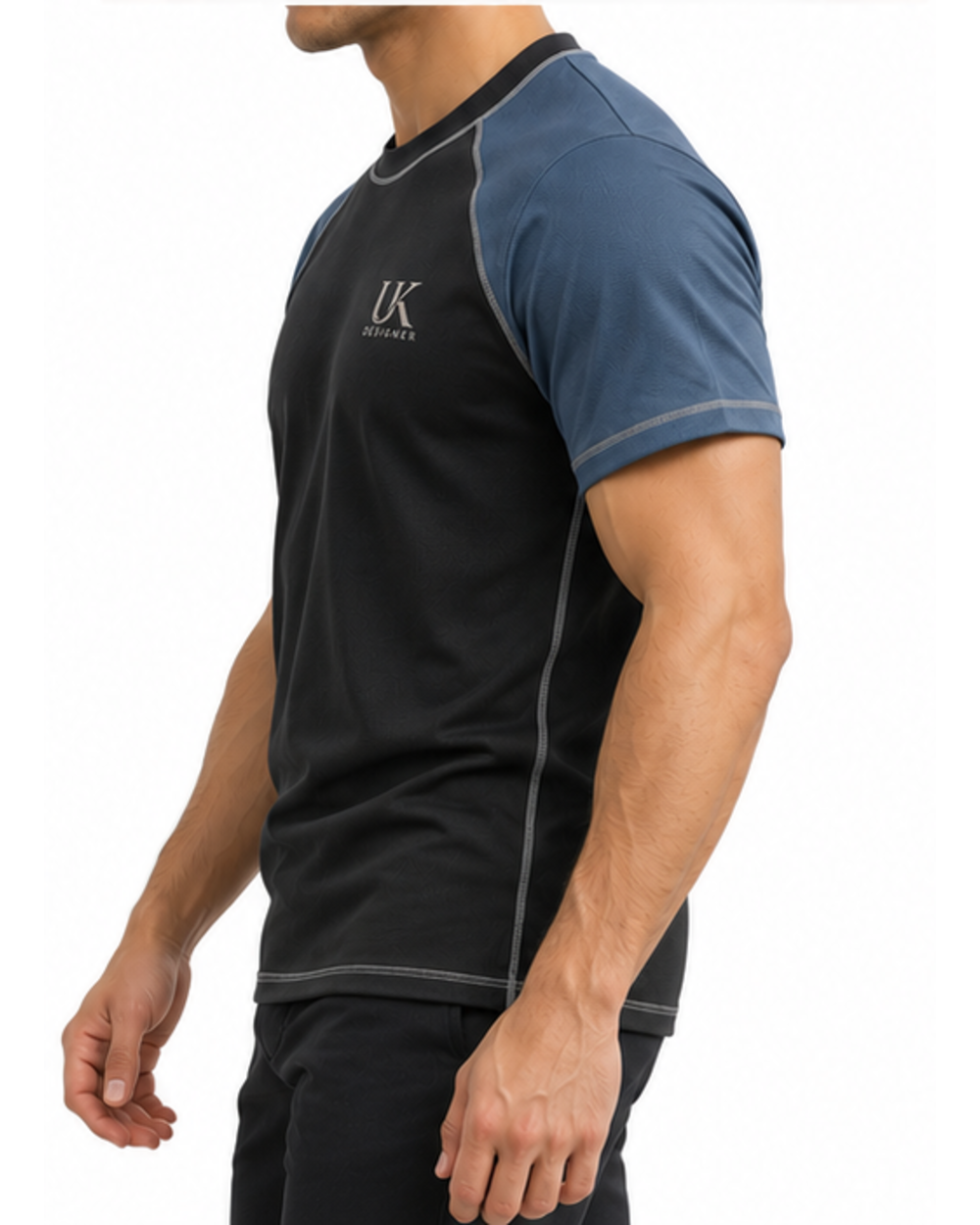 Side view of the raglan T-shirt on a model with black trousers