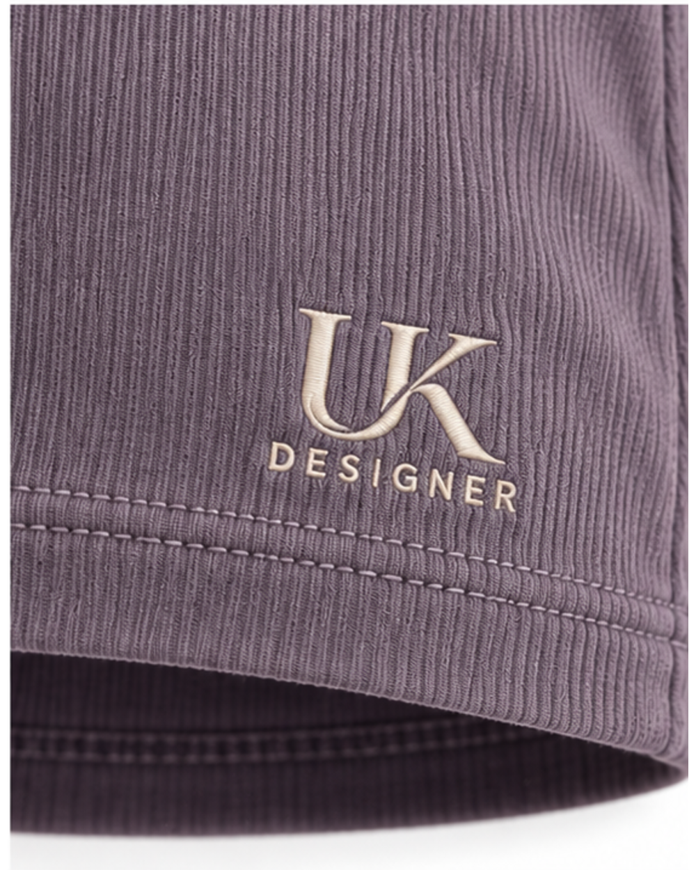 Close-up of the fine rib and embroidered logo at the front hem