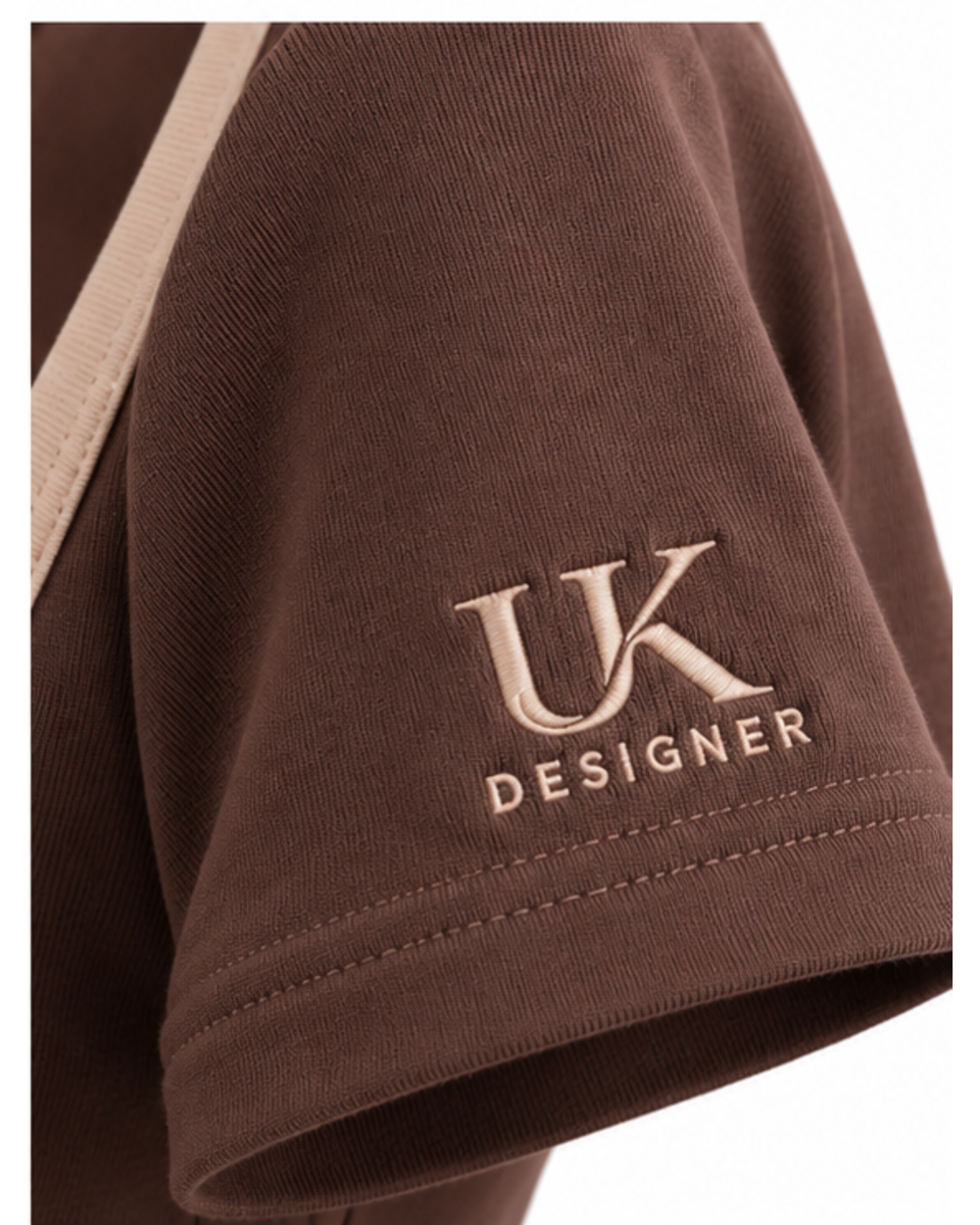 Close-up of the embroidered logo on the left sleeve hem