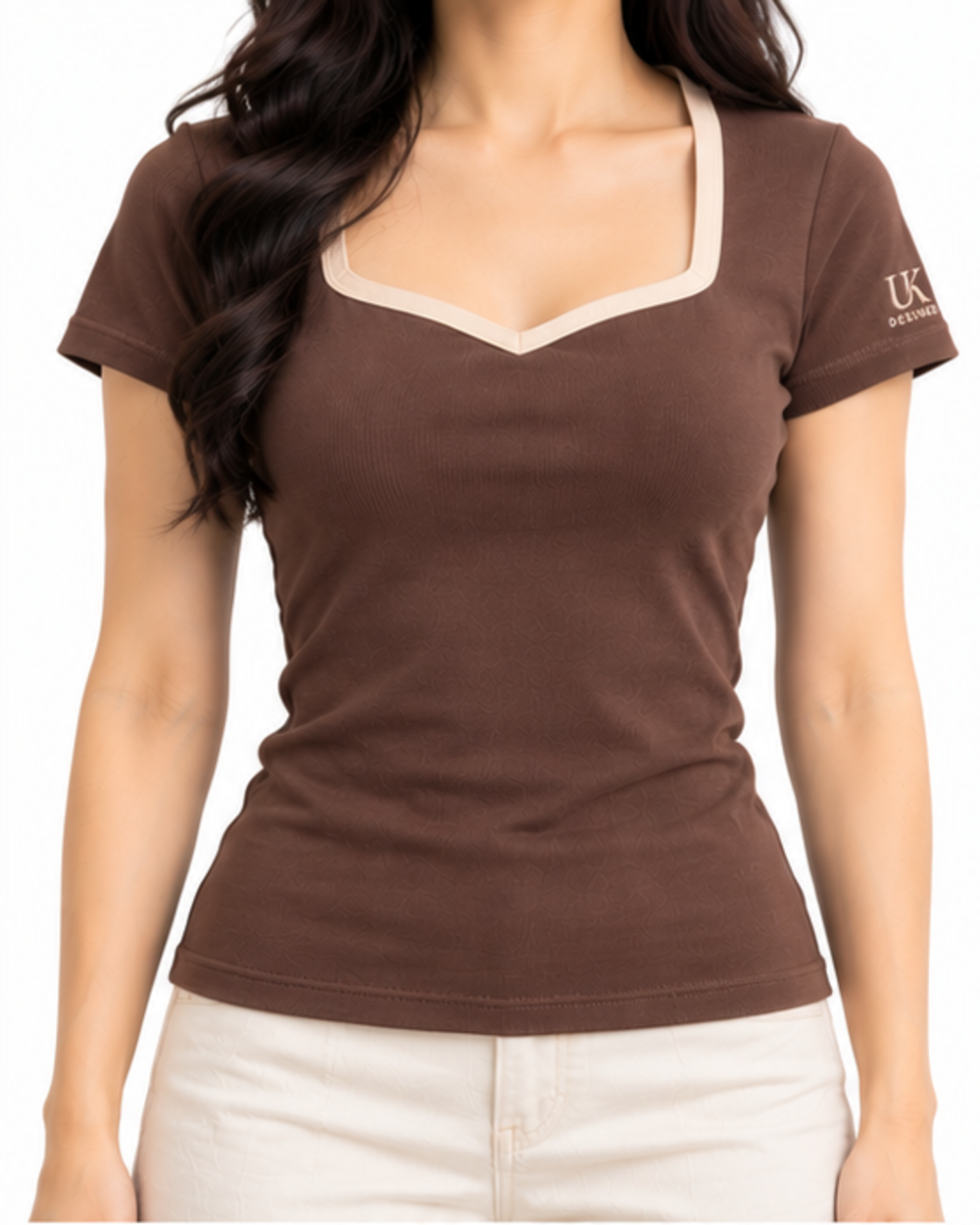 Model wearing the cocoa sweetheart T-shirt with cream trousers